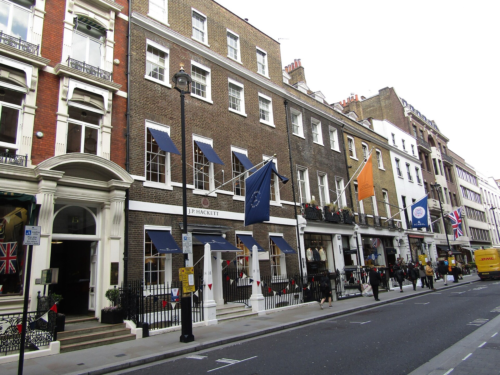Savile Row, London: the houses' awnings and flags along the street where bespoke tailoring was formalised