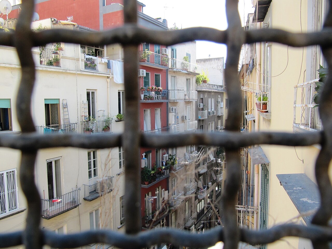 Via Chiaia, Naples, seen through an iron grille