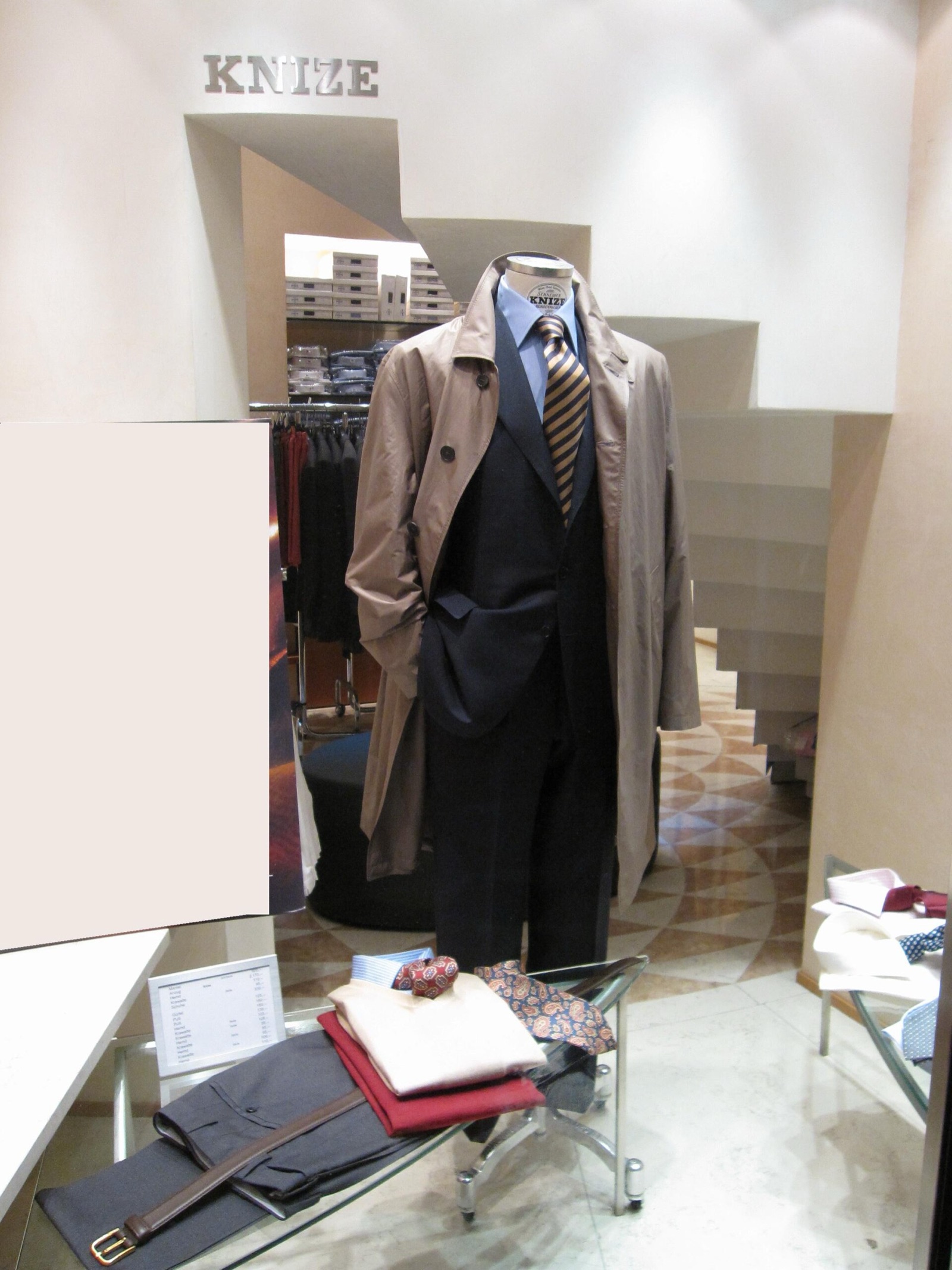 A Knize suit and raincoat displayed inside the Vienna shop