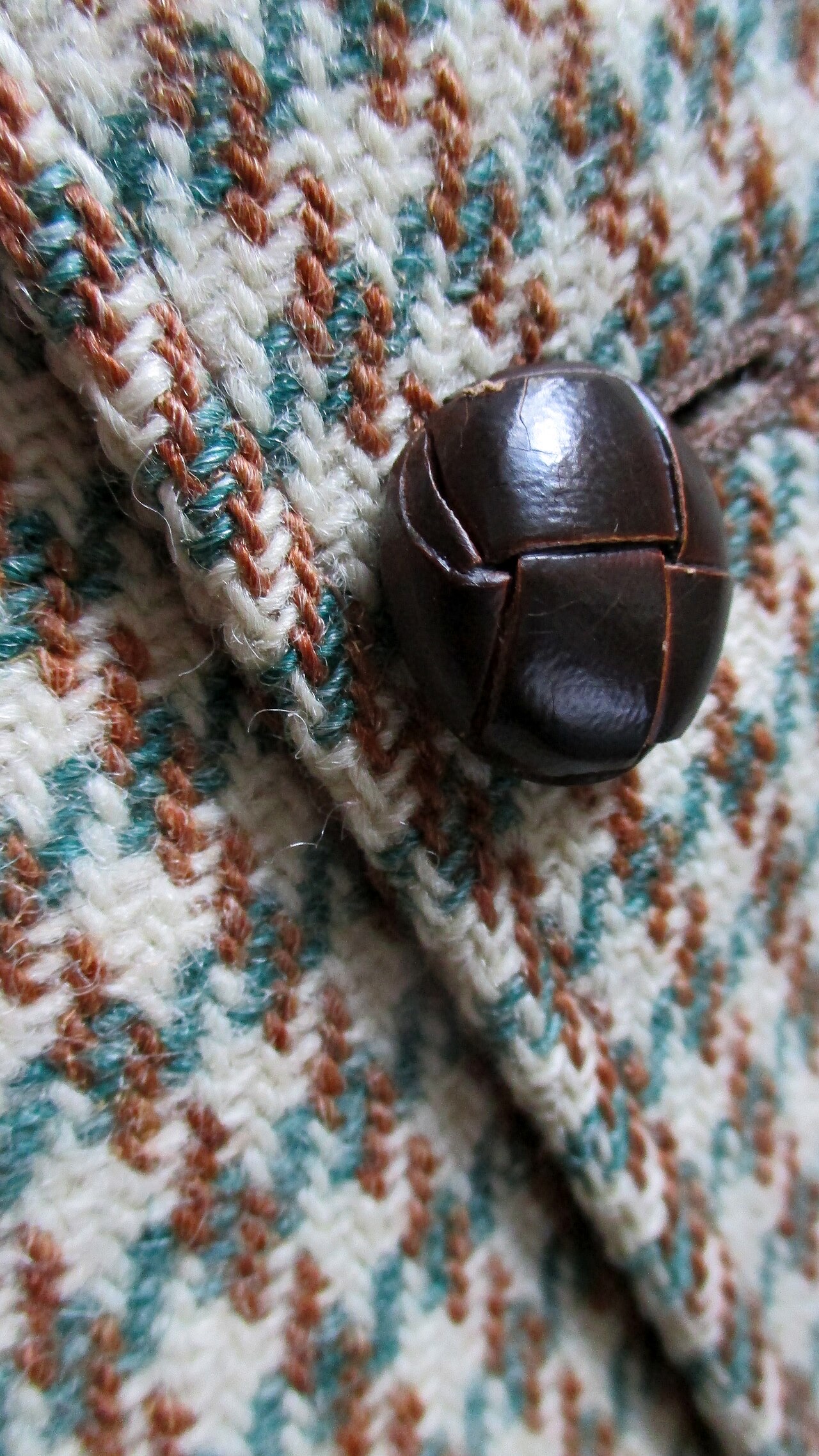 A Harris Tweed weaver at a treadle loom